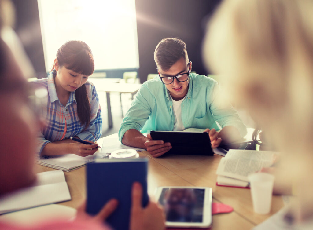 group of high school students with tablet pc